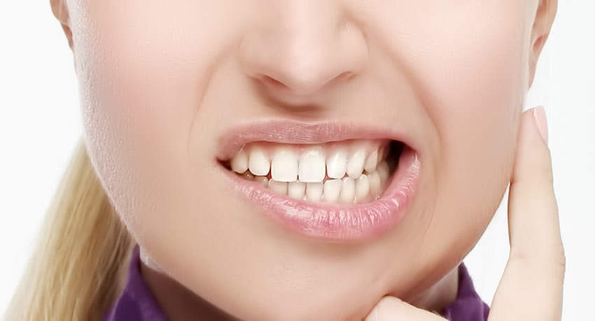 como saber se estou apertando os dentes à noite